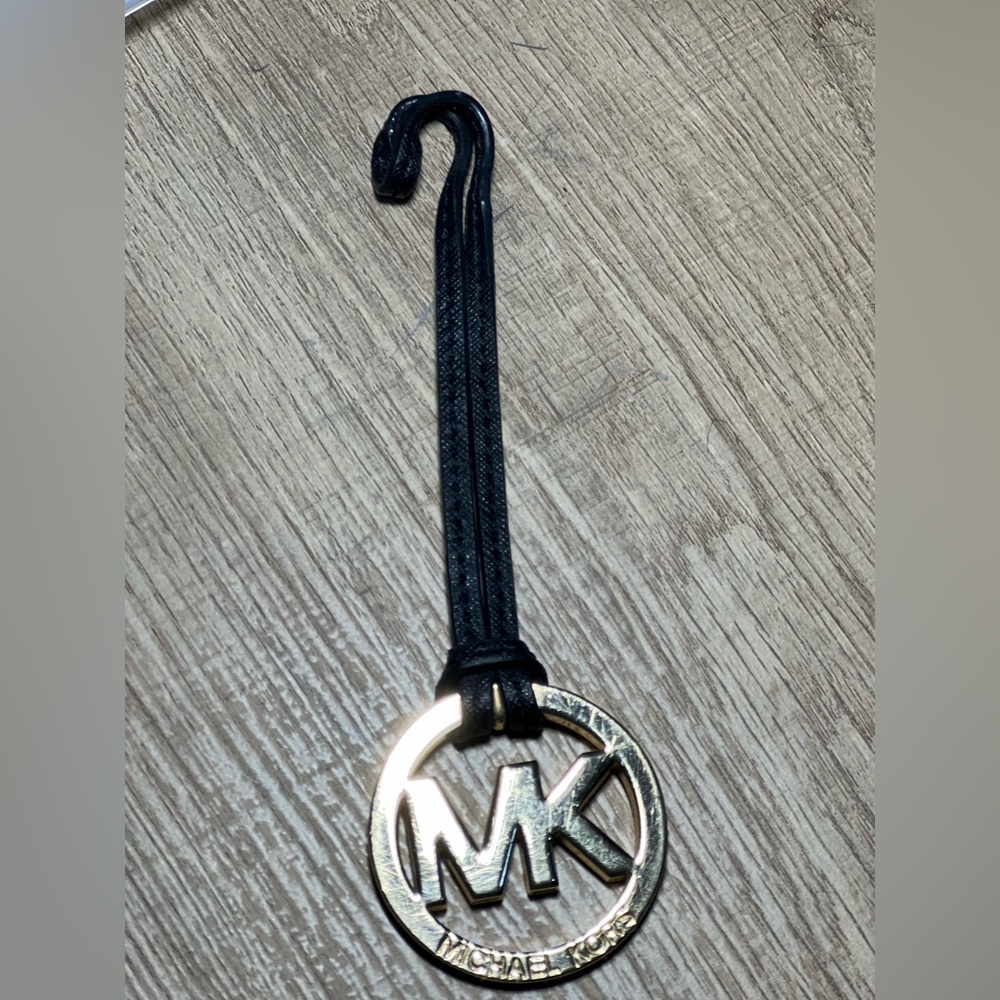 Michael Kors Gold and Black and gold medallion bag charm